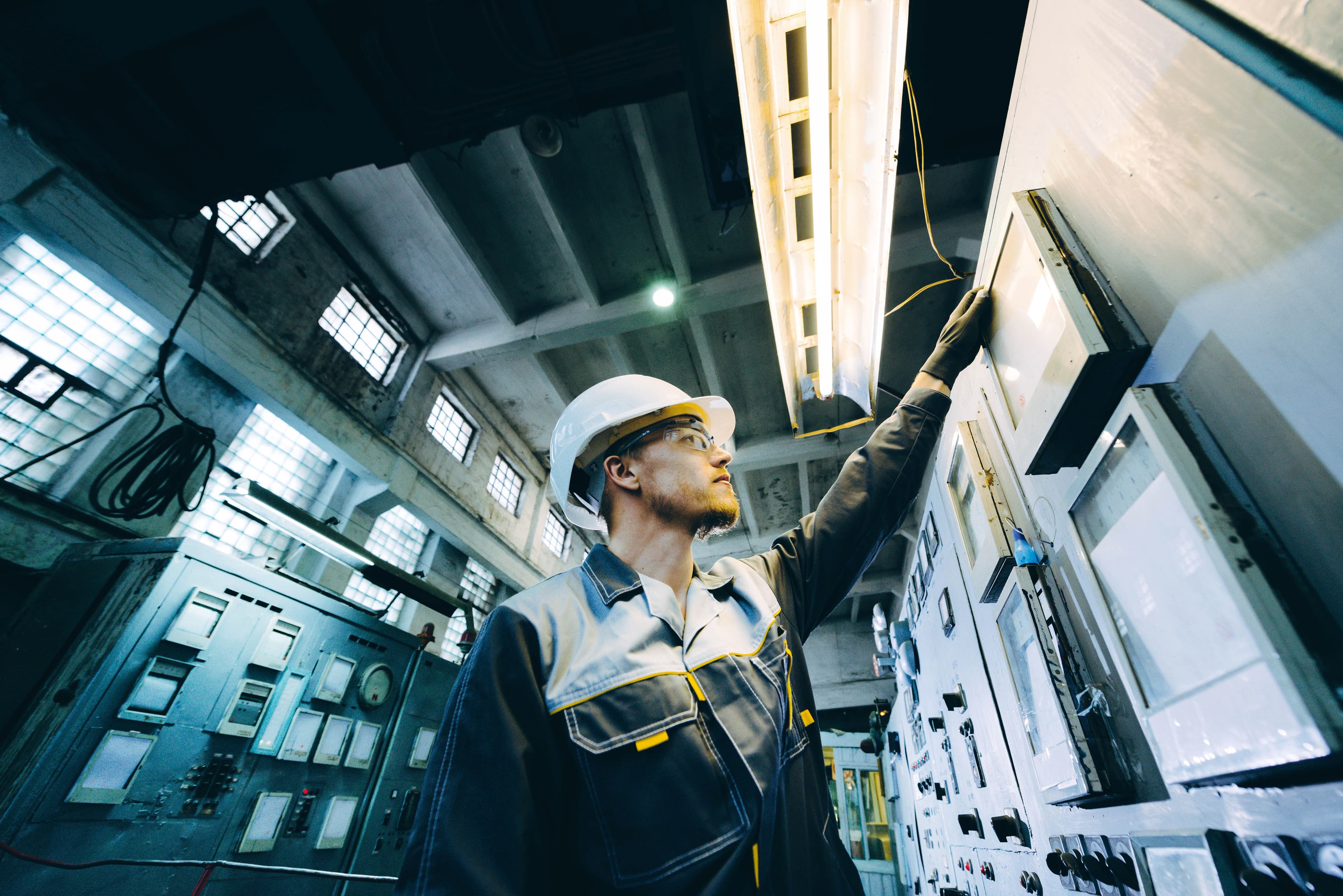 Industrial worker using control panel