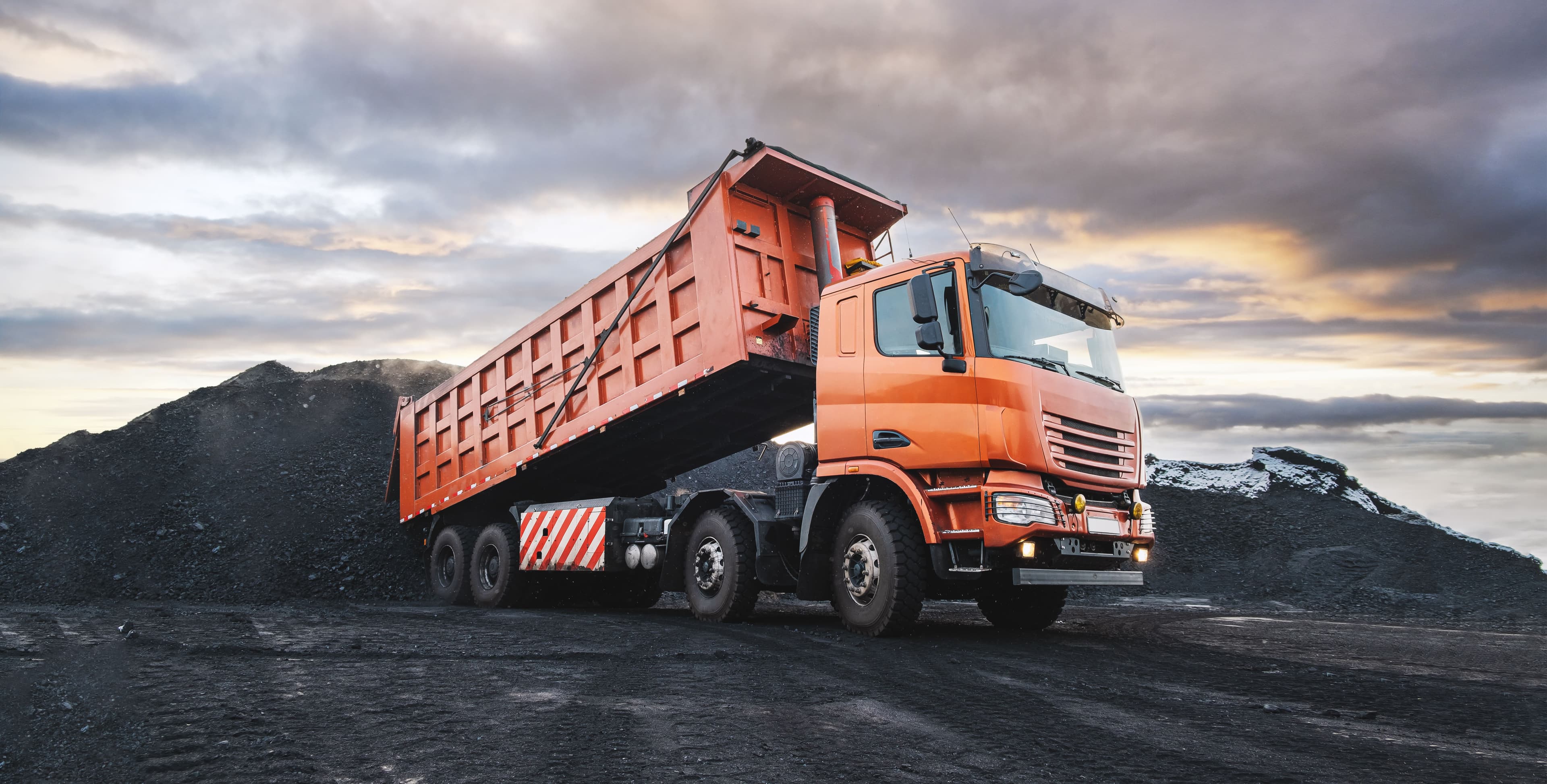 Orange HGV dipper unloading material