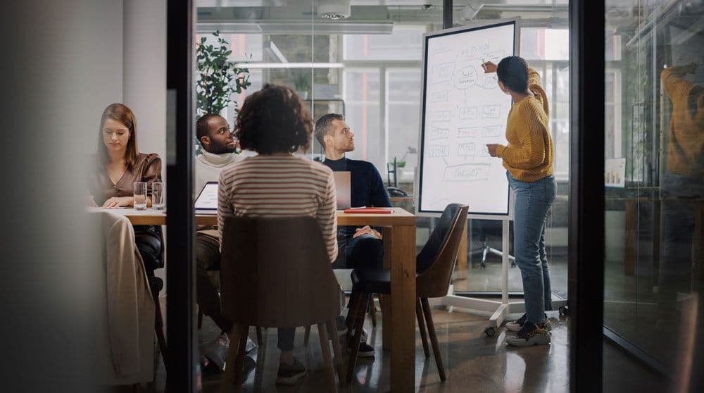 Multiple people attending a business meeting