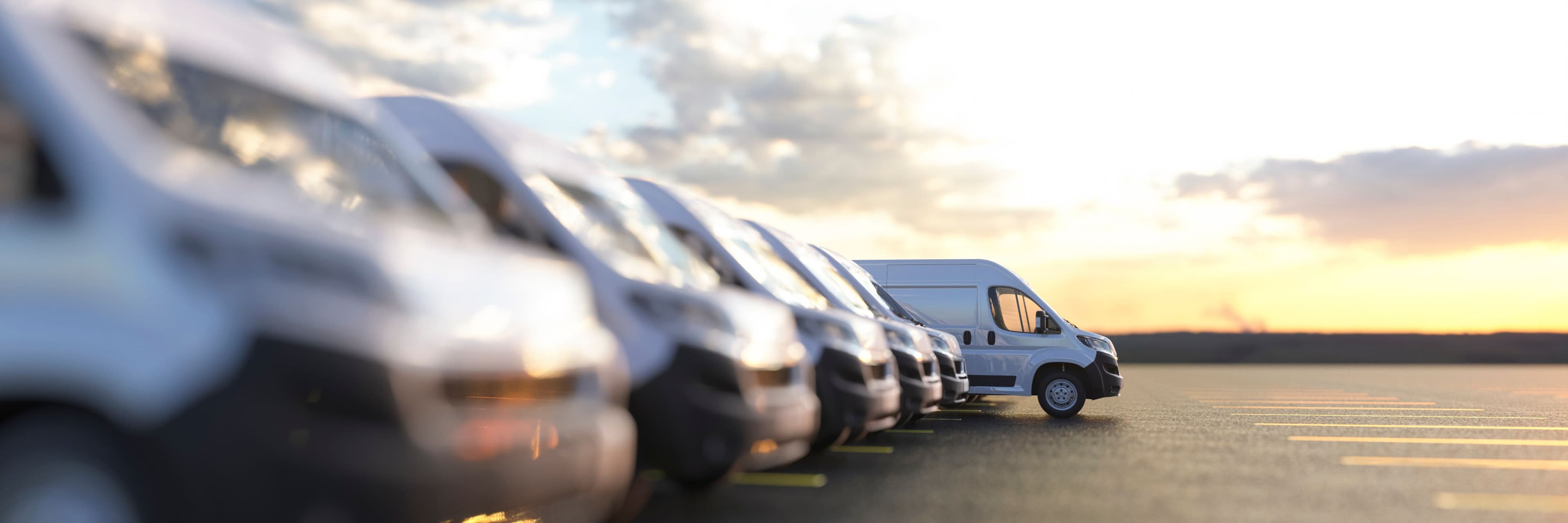 A line of parked vans