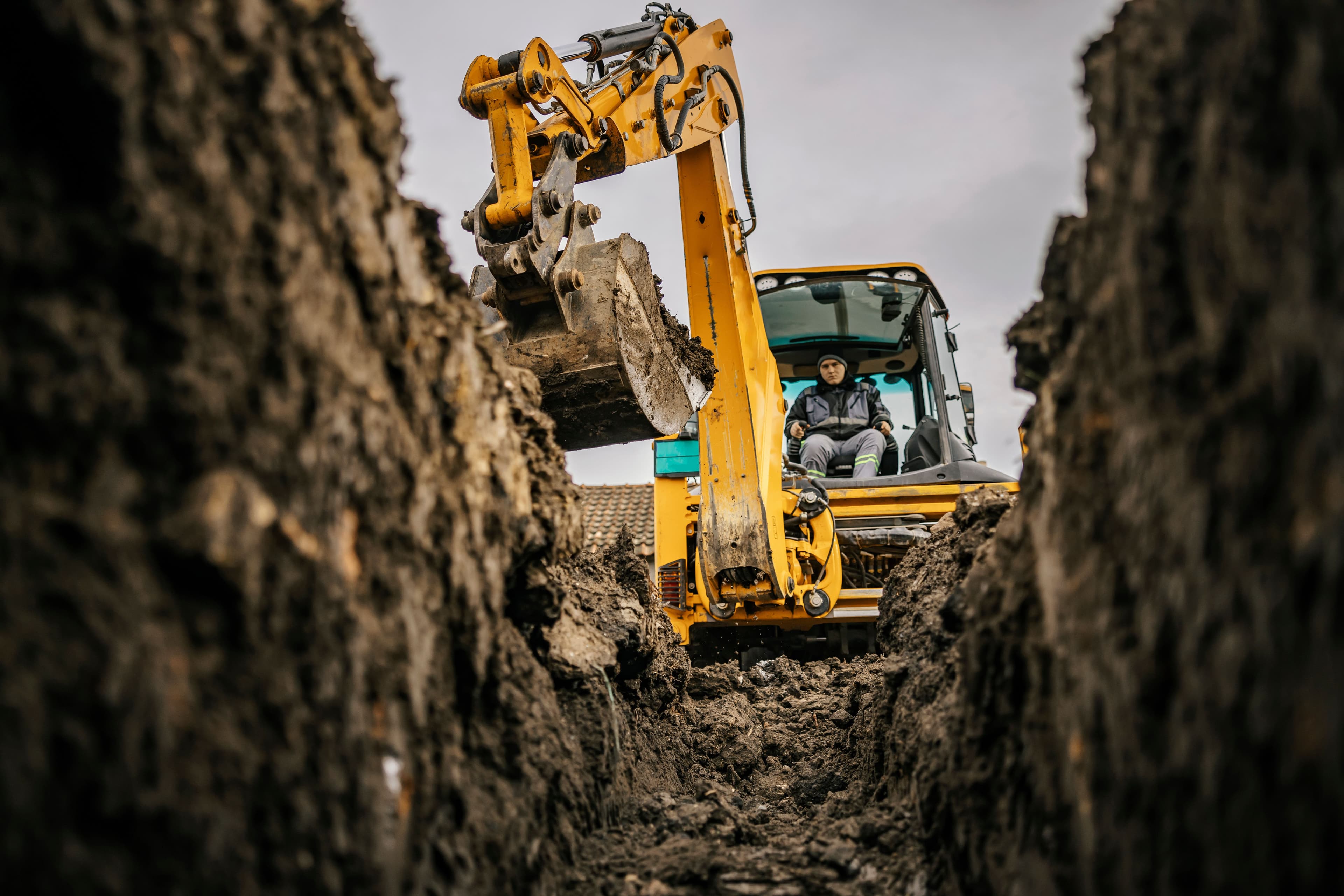 A yellow digger removing dirt