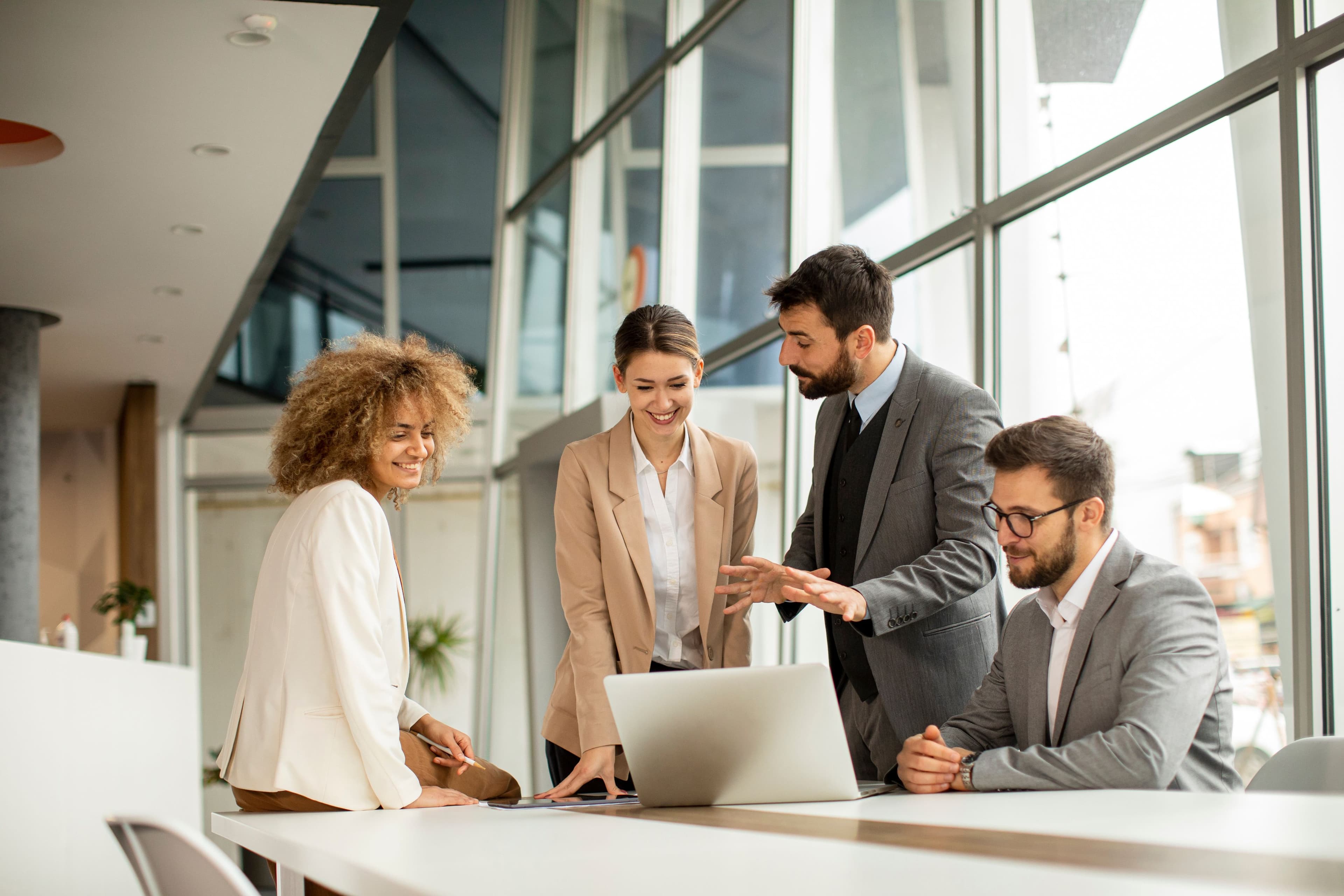 Four people having a business meeting at a table