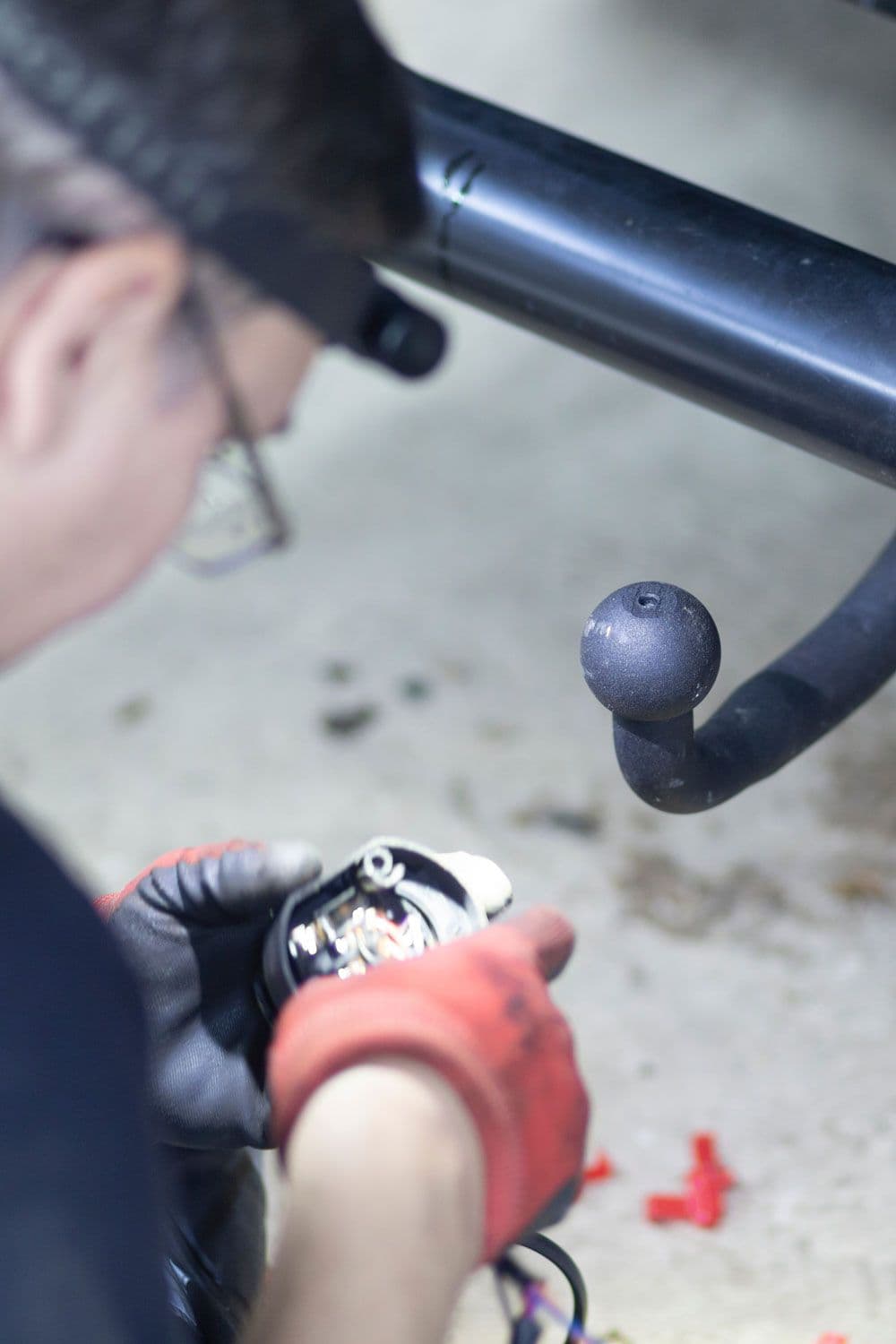 A mechanic installing a tow bar